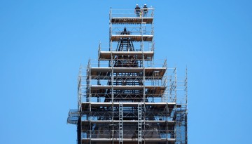 Workers continue with the roof removal from McGraw Tower.