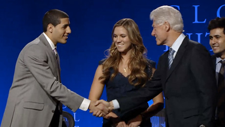 Cornell student shakes hands with Bill Clinton