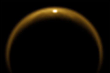 Sunlight reflects off Titan, Saturn's largest moon.