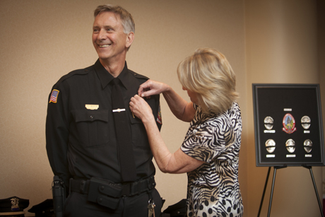 Phil Mospan receives his lieutenant’s collar brass insignia.