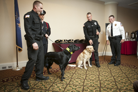 Cornell police dogs and their handlers sworn in.