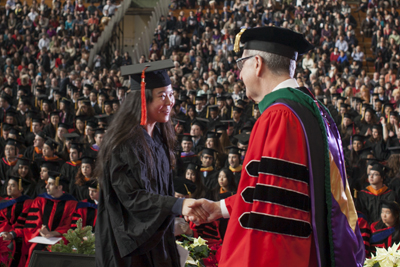 graduate shakes hands