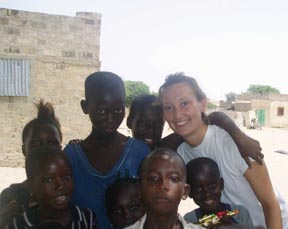 Cyprienne Crowley poses with children in Dakar, Senegal