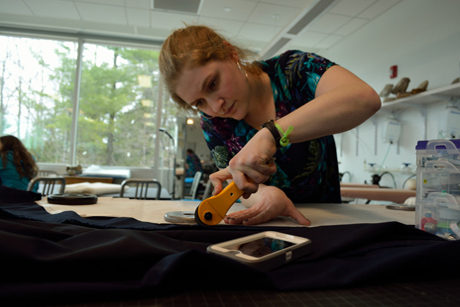 FSAD designer Caroline Delson ’13 works with materials for her menswear collection.