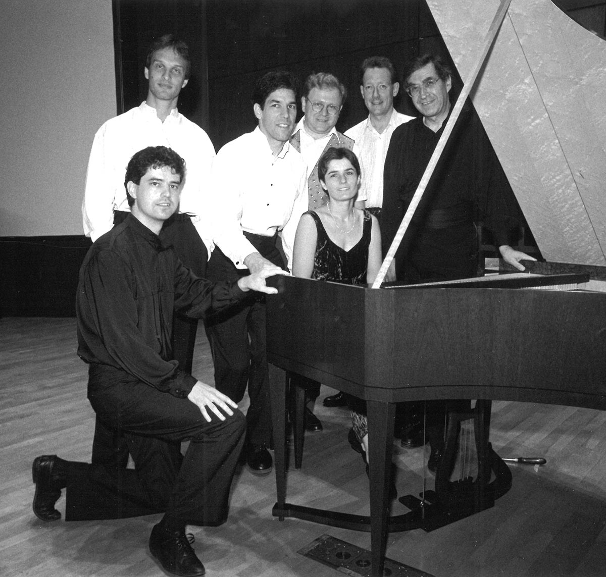 Cornell Seven around piano