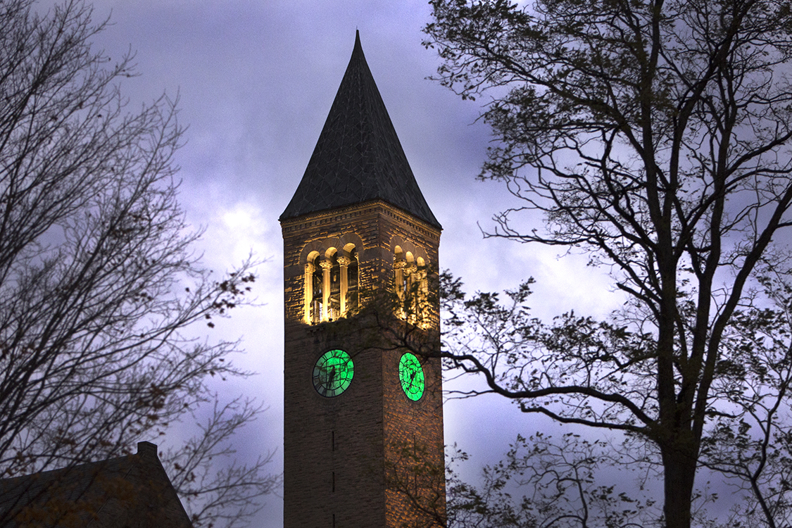 McGraw Tower lit green for Veterans Day