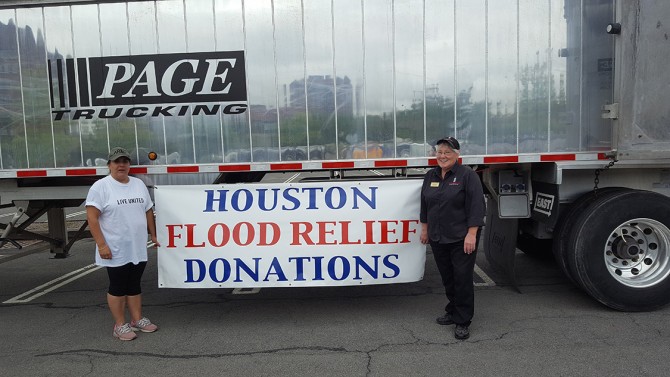 Karen Trask and Ronnie Horton in front of a truckload of supplies
