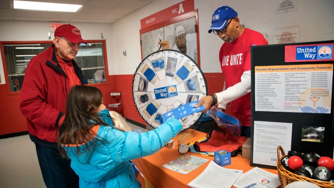 Ed and Savanna Pasto spin the United Way prize wheel