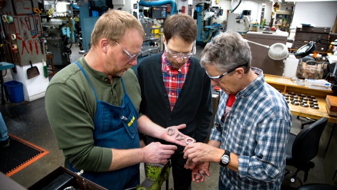Machinist Jeff Koski, left, works with Thomas Nikola, research associate, and Chuck Henderson, research support specialist, both from the Cornell Center for Astrophysics and Planetary Science.