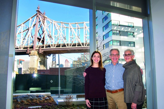 From right, Ellen and Mark, along with their daughter, Jill Wurzel ’02, make a stop in the conference room during a tour of the center in Februar
