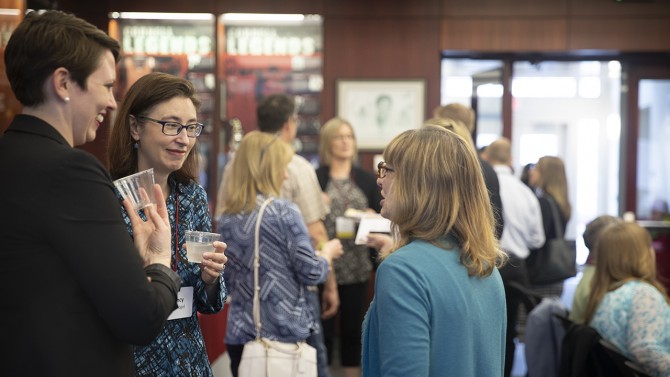 Staff graduates network at the 22nd annual Staff Graduate Reception May 16.