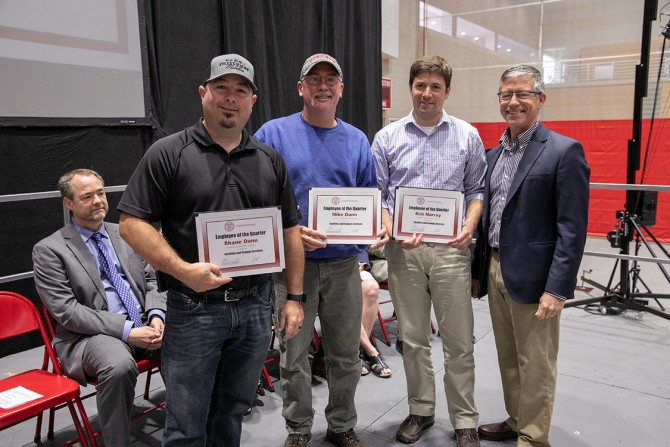 Shane Dunn, Mike Dunn and Rob Murray receive the Employee of the Quaarter Award for their work with the Millstein Hall roof leaks. 
