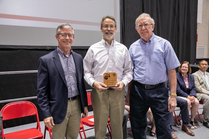 Lanny Joyce receives the Cornell University Partners in Sustainability Lifetime Achievement Award., with Rick Burgess at left and Michael Hoffman at right.