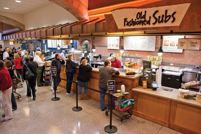 Customers line up for fresh sandwiches from the Wegmans deli