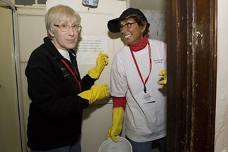 Arlene Savitsky, left, and Penny Haitkin clean bathrooms