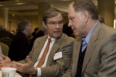 Cornell trustee David Croll speaks with Jeff Tester during a conference