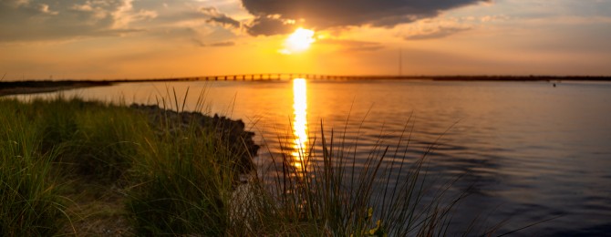 Sunset With Bridge Over Water