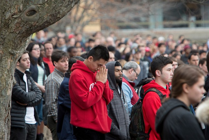 A student observes the moment of silence