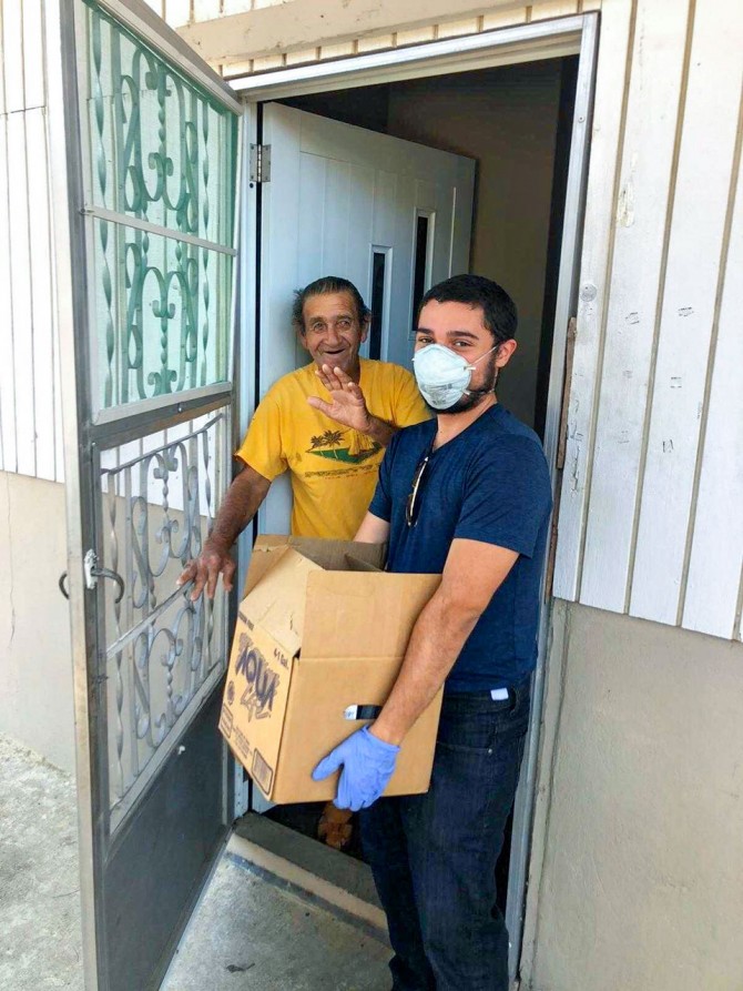 Volunteer James Mercado delivers goods