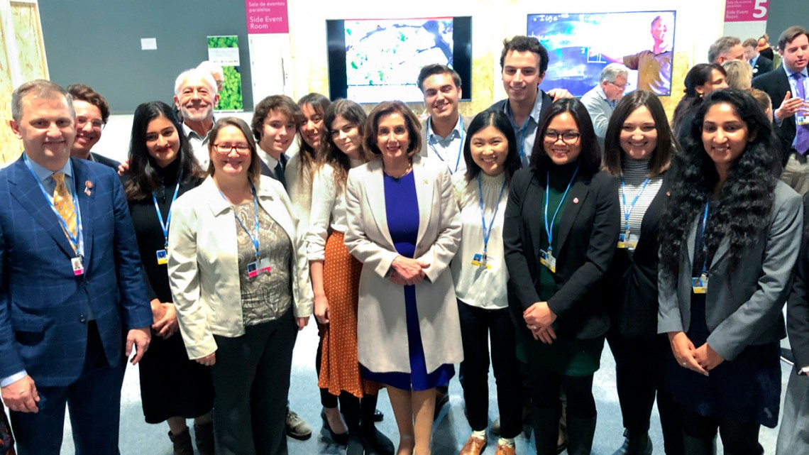 Pelosi and students at COP25