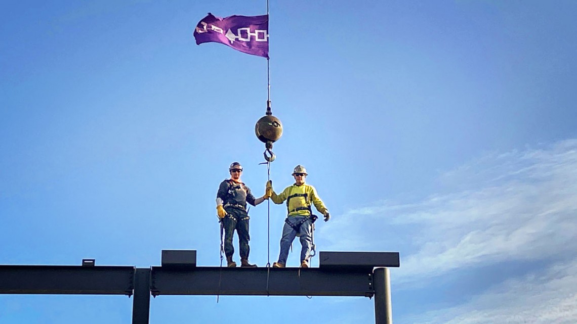 Ironworkers with Hiawatha wampum belt on top of NCRE building