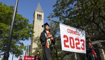 Graduates proceed to Schoellkopf Field from the Arts Quad.