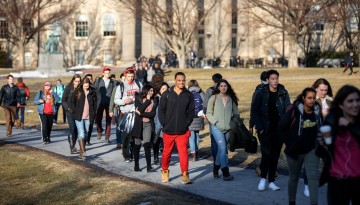 Students walk on Arts Quad