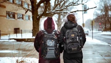 Students walk in snow