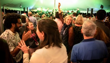 Reunion attendees dancing under the tent. 