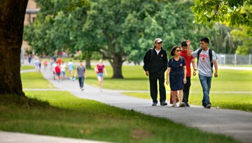 A family walking on campus. 