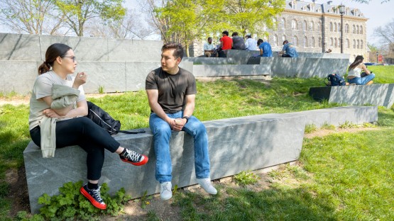 Students enjoy a warm spring day on the Sesquicentennial Grove.