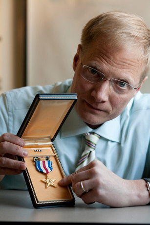 Brian Wansink with a World War II medal.