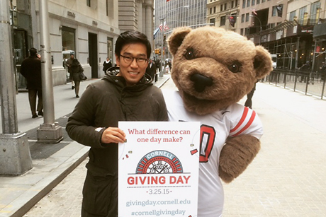 Big Red Bear with alumnus on Wall Street