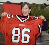 Susan Murphy proudly shows off the Big Red football jersey