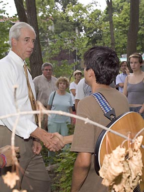 President Hunter Rawlings shakes the hand of Fabian Canas