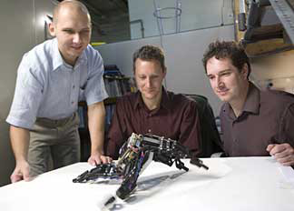 researchers with robot
