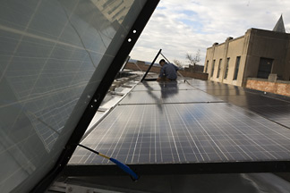 Robert Garrity installs solar panels