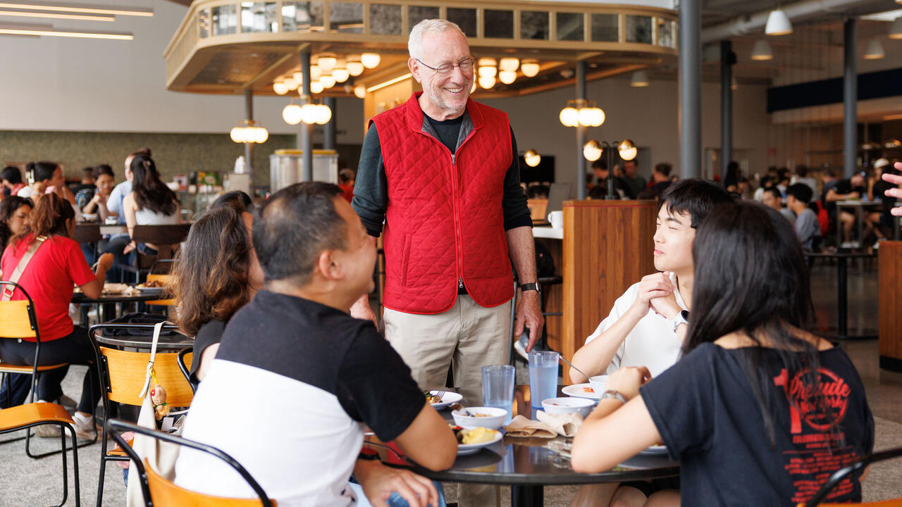 Cornell President Michael I. Kotlikoff welcoming families and students on move-in day at Morrison Dining.