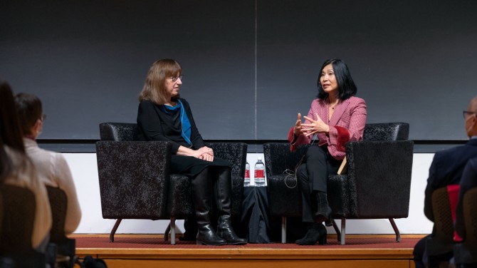 Angela Hwang, MBA ’94, speaks with Cornell President Martha E. Pollack.
