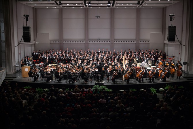 An orchestra and a chorus on a stage