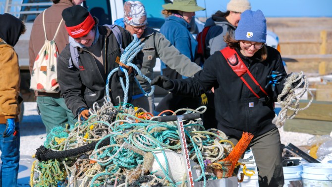 Hal Reed and Sophie Cianfarani haul ropes collected from the shores of Cuttyhunk Island.