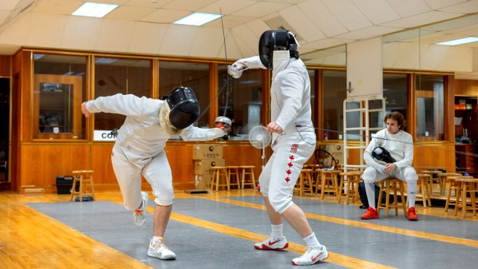 Riley Xian '25 (right), Men's Fencing Club co-captain, led the épéeists to gold at the U.S. Association of Collegiate Fencing Clubs championships on April 13-14.