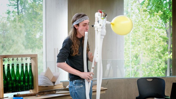 Cornell Physics junior J Nation performing on their balloon-powered 