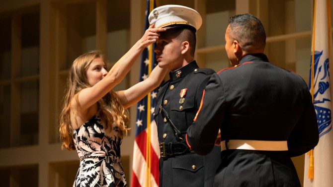 Socrates Kastanos is decorated after being commissioned as a second lieutenant at the 2022 ROTC Commisisoning Ceremony in the Alice Statler Auditorium.