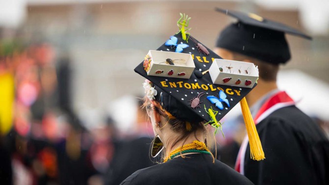 A student's decorated mortarboard at the 2022 Commencement ceremony at Schoelkopff Field.