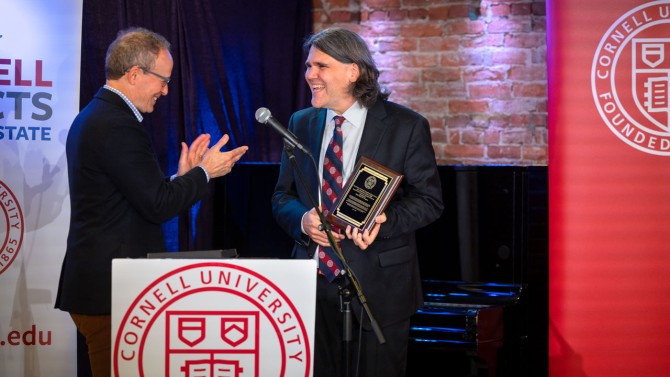 Mastrianni is presented with the Hometown Alumni Award by Joel M. Malina, vice president for university relations.