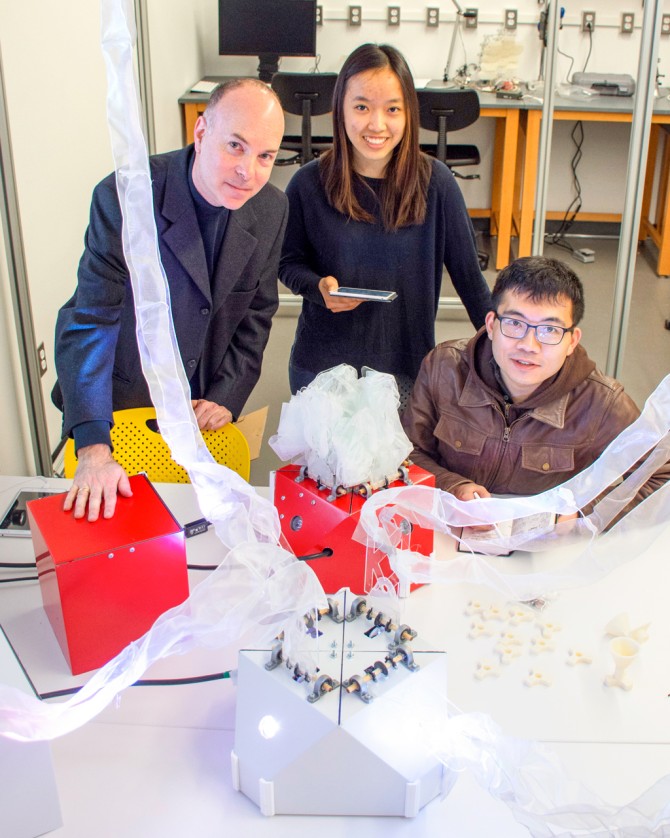 Keith Evan Green, left, director of the Architectural Robotics Lab, with students in the lab.