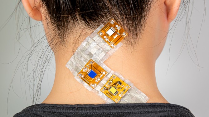 SkinKit wearable sensing interface on woman's neck