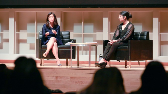 Christina Li, MBA ’04, left, managing director at Goldman Sachs, talks with Women Leaders of Color founder and president Trisha Beher ’25 at an event on Oct. 18.