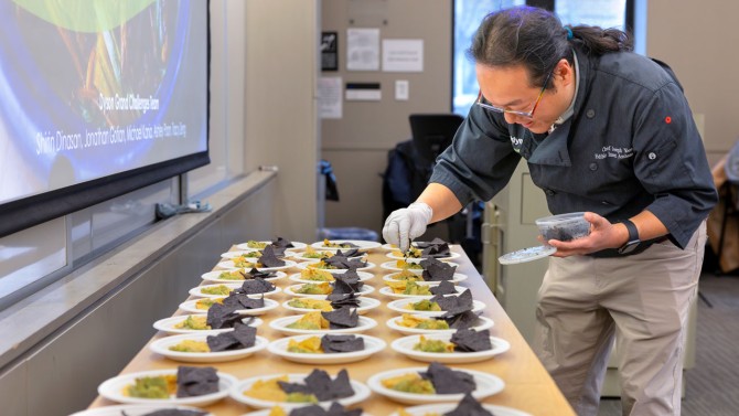 Chef Joseph Yoon, founder of Brooklyn Bugs, Inc., sprinkled black ants onto avocado served with tortilla chips.